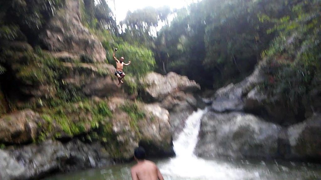 cliffjumping into a beautiful river in puerto rico