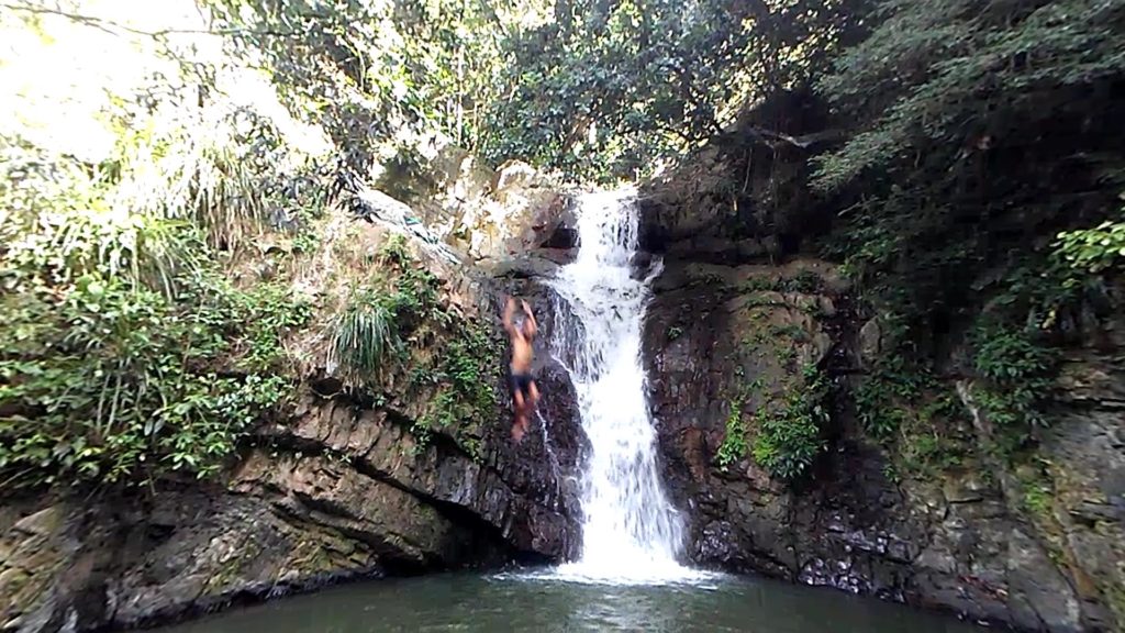 Jumping in a beautiful waterfall in puerto rico
